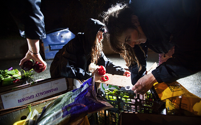 Image: May Wollf and Robin Pickell sort through food they pIcked out of a dumpster in Coquitlam, British Columbia