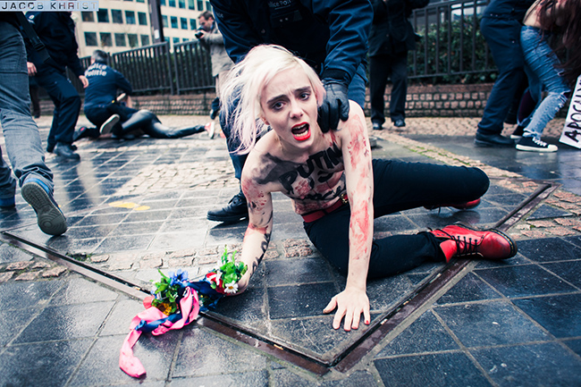 Femen happening against poutine in Brussel