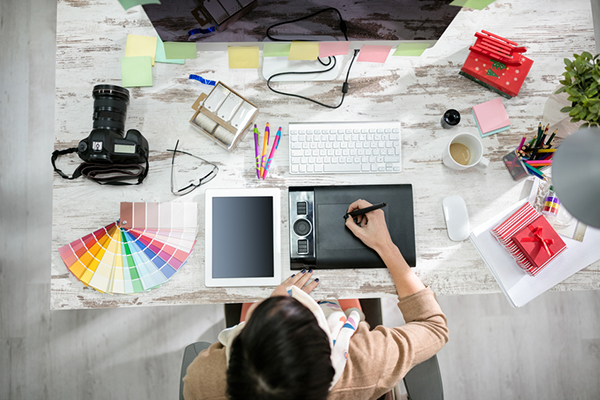 woman designer working on the pen table